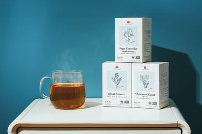 A cup of Sugar Controller Herb Tea with the product's boxes in the background